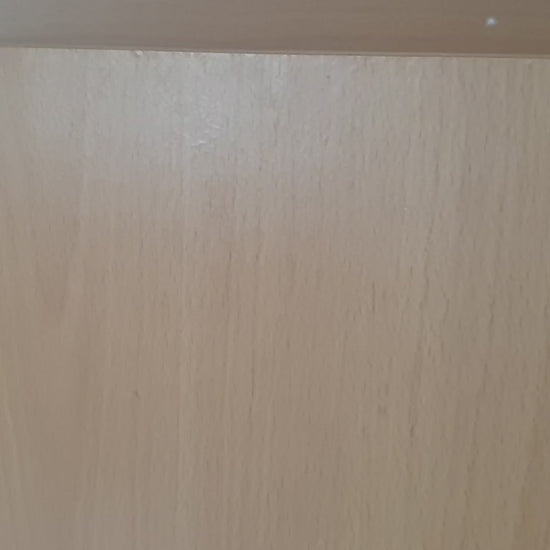 Close-up of light wood surface, showing natural grain and texture ideal for furniture or decor backgrounds.